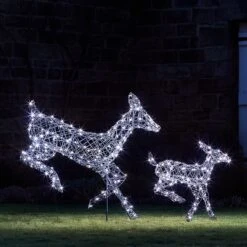 Regular Harlow Rattan Doe & Fawn Dual Colour LED Light Up Reindeer 24v 21 Regular Harlow Rattan Doe & Fawn Dual Colour LED Light Up Reindeer 24v -Holiday Decor Shop XX2103 Harlow Rattan Doe and Fawn Light Up Reindeer Pair Cool White Grass